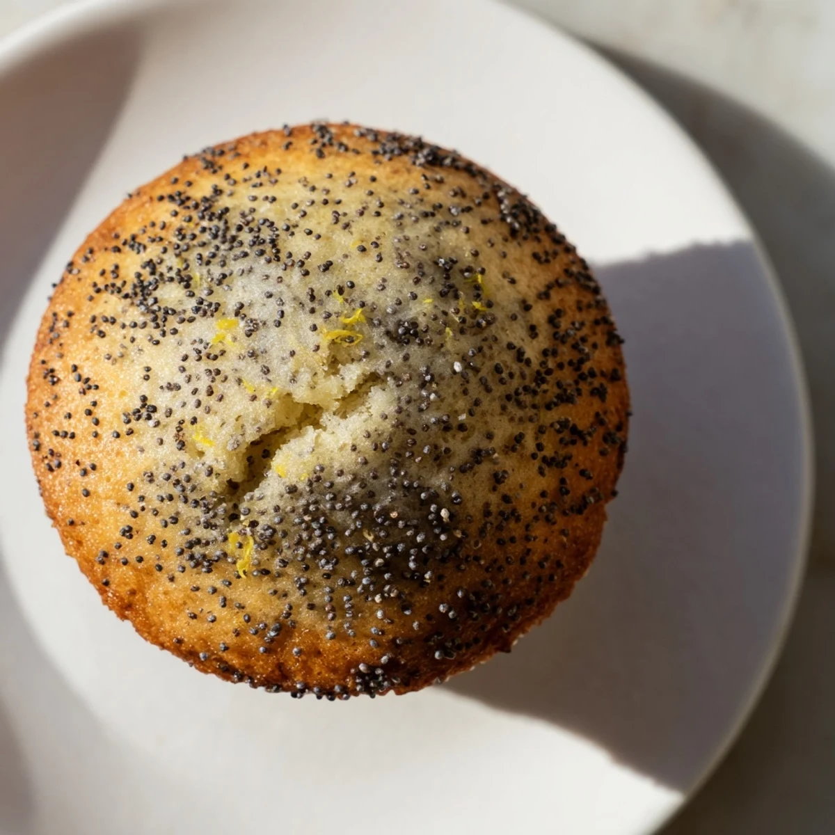 Fluffy Lemon Poppy Seed Muffins with a drizzle of sweet lemon glaze, ready to serve.