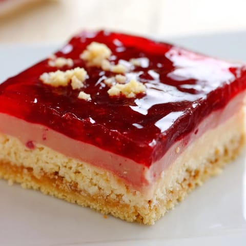 A close-up of buttery Simple Homemade Strawberry Jam Squares, a perfect quick dessert recipe with jam.
