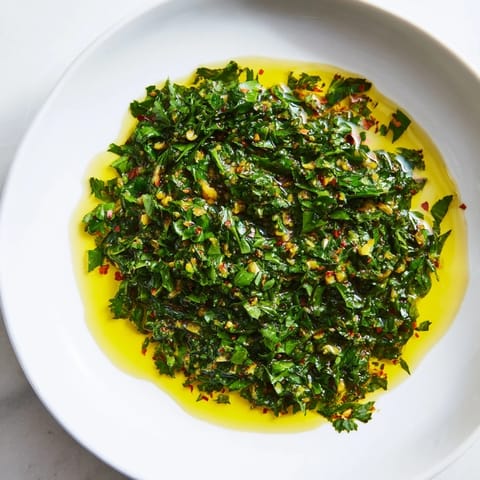 Close-up of the fragrant Moroccan Chermoula Marinade, with visible herbs and oils, ideal for marinating seafood.