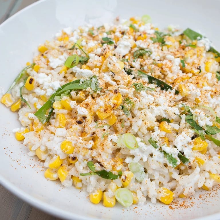 A bowl of flavorful Mexican Street Corn Rice with visible cilantro, perfect for a vibrant side.
